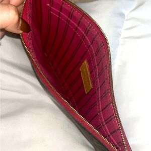 Real Louis Vuitton wristlet with pink inside 
Basically brand new